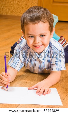 The boy draws pencils