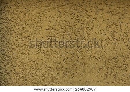 Close-up of stucco wall texture sandy color