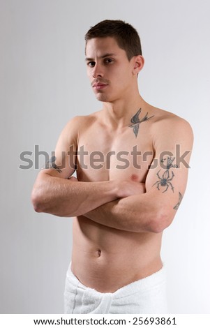 stock photo : stern looking young man with tattoos