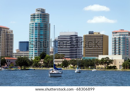 Boat are moored in the yacht basin with the city skyline of downtown St. Petersburg, Florida in the background.