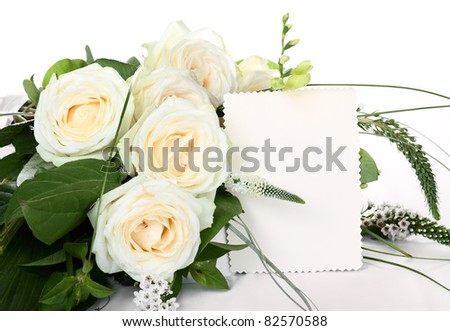 Bouquet of light vanilla roses with empty cards.