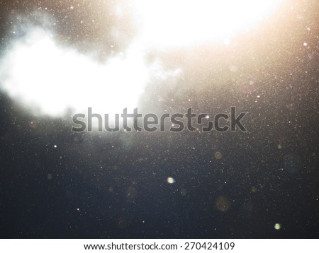 Abstract background with floating dust and garnish with translucent clouds