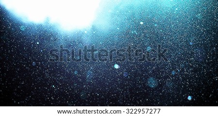 Abstract blue banner background with floating dust and garnish with translucent clouds