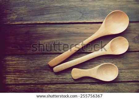 wood  spoon on wood  background dark brown.