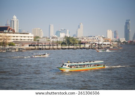BANGKOK, THAILAND - MARCH 15, 2015: The tourists get on boat for sightseeing along Chao Phraya River in Bangkok.