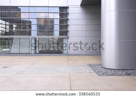 silver metal column and glass paned windows exterior of office building