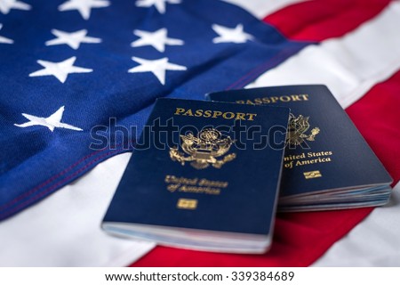 United States Passports on top of an American Flag