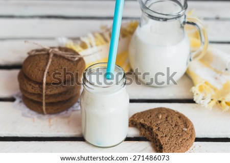 Rustic home made tasty  cookies on the wooden background with milk. Selective focus photo with shallow DOF.