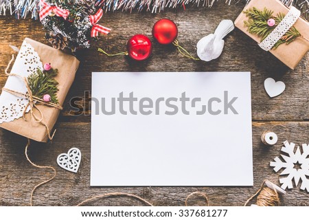 Stylish branding mockup to display your artworks. Cute vintage christmas new year gifts mock up on wooden background.
