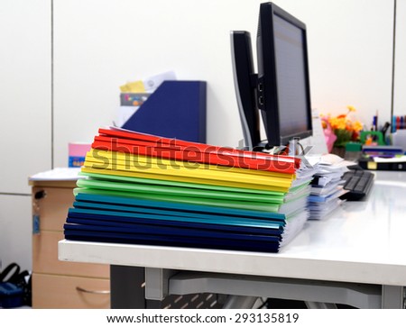 The file consists of multicolored plastic ridge, blue, yellow, red, and green on the table to be used for training.