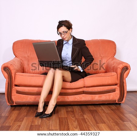 Businesswoman sitting and working on lap top computer