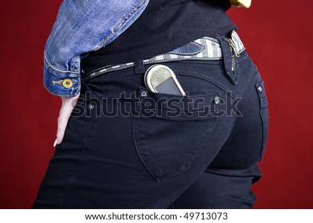 Cell phone in back pocket of girl\'s jeans