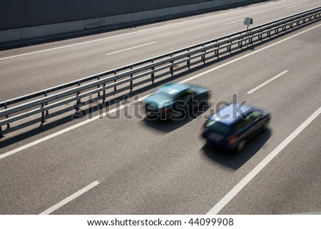 Fast-moving vehicles on the highway.