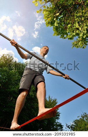 an athlete who is training to walk a tight rope