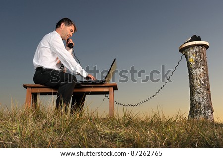 a businessman who phones in the countryside