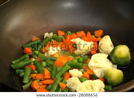 Stir fry vegetables in a wok pan - closeup