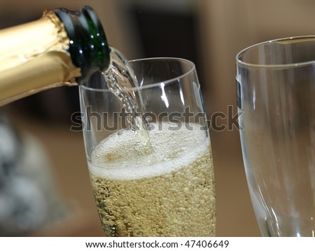 Champagne pouring into the glass
