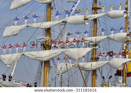 Ij river, Amsterdam, the Netherlands - August 23, 2015: Sailors of the ARC Gloria tall ship (Colombia), on the masts, on the last day of the SAIL (www.sail.nl), an international public nautical event.