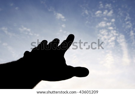 Hand reaching to the sky