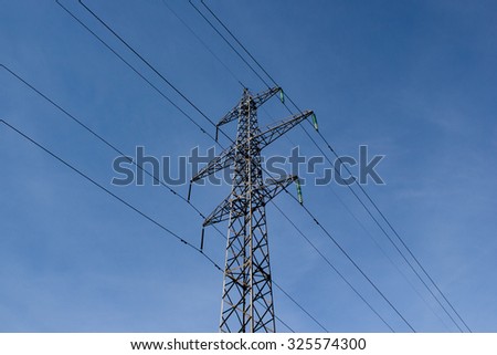 High voltage post. High-voltage tower sky background. power lines.