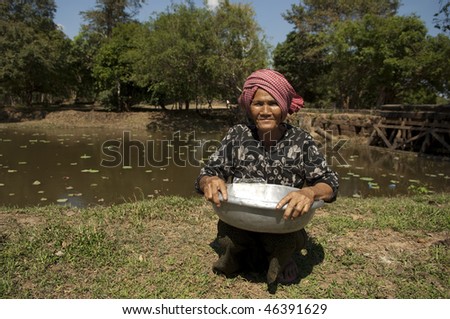 cambodia vietnam old asian woman selling rice cookies
