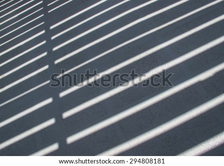 Shadow and Light Striped Pattern\
Floor of a boat during a hot summer day. Pattern made of stripes, light and shadow.