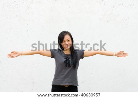 stock photo beautiful asian young woman spread her arms wide open