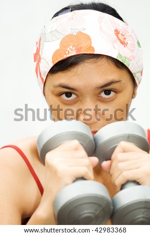 closeup face energetic expression of asian young woman during fitness