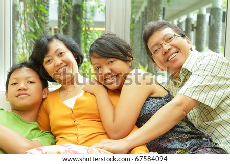 Togetherness of happy Asian ethnic family