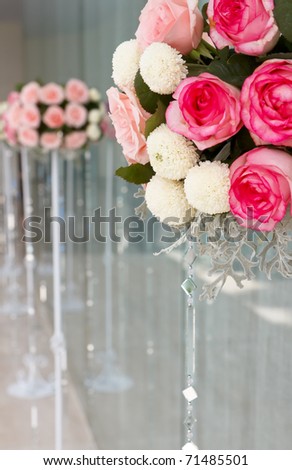 Beautiful rose flowers bucket arrangement at wedding