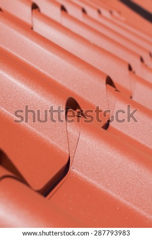Red metal tile close-up