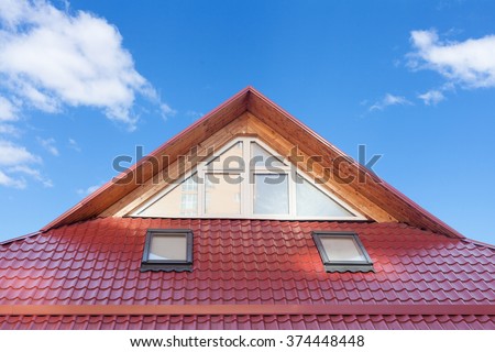 Red Metal tiled Roof with New Dormers, Roof Windows, Skylights and Roof Protection from Snow Board