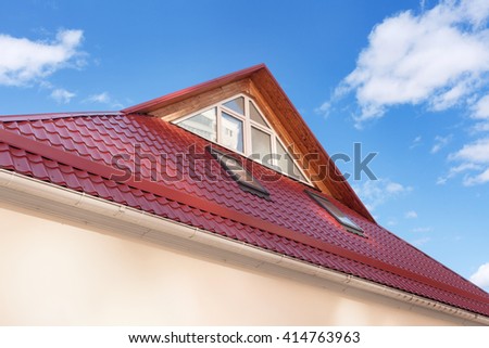 Red Metal tiled Roof with New Dormers, Roof Windows, Skylights and Roof Protection from Snow Board