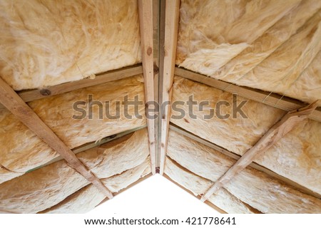 Insulation of attic with fiberglass cold barrier and insulation material
