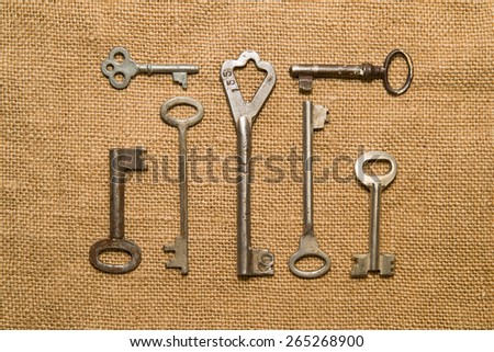 Seven vintage keys to the safe on old cloth