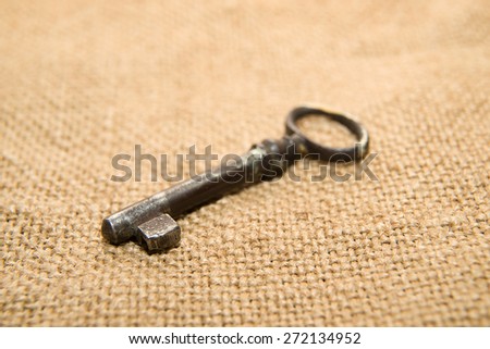 Vintage key to the safe on old cloth