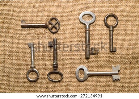 A lot vintage keys to the safe on a very old cloth