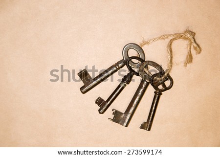 Some vintage keys on a rope on paper craft