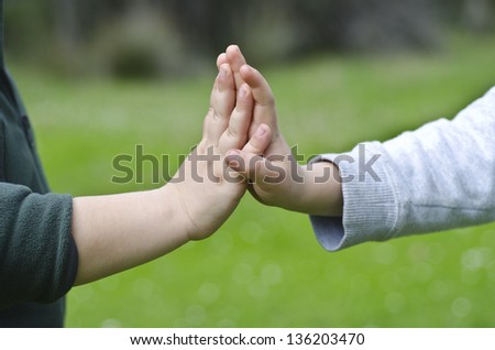 hands child son in summer forest nature outdoor, trust family concept
