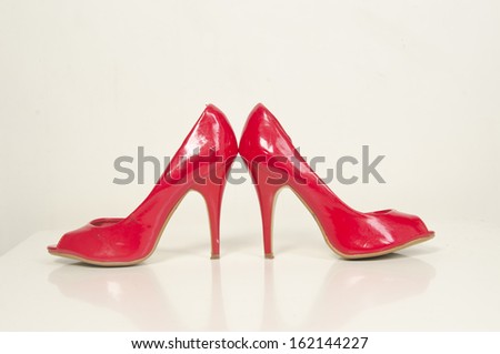 Red high heel women shoes on white background