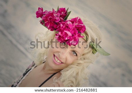 Closeup Portrait of Pretty Woman with Wreath of Pink Flowers. Natural Beauty
