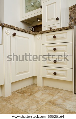 Modern contemporary kitchen interior with granite worktop and cream units
