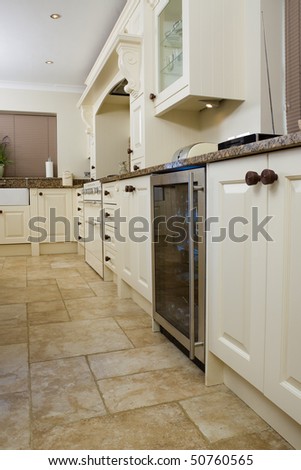 Designer modern kitchen interior with granite worktop and cream units