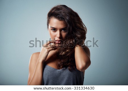 close-up portrait of beautiful brunette mixed race girl. Beauty woman over isolated background, make-up
