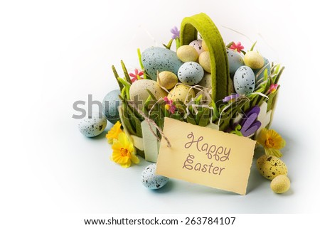 art Easter eggs basket on wooden background