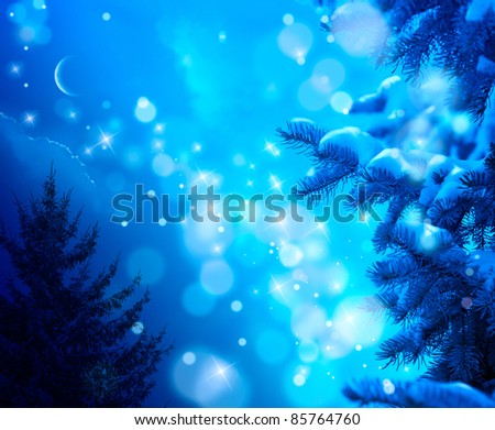 snow-covered Christmas tree on a blue night sky background