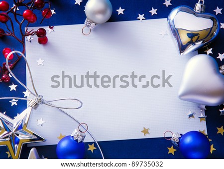 Design a Christmas greeting with a paper on a blue background