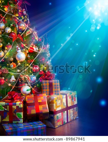 Christmas gifts near the Christmas tree in a magical Christmas Eve