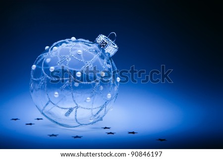 design christmas card with christmas ball on dark blue background