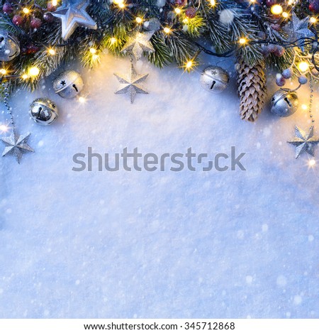 Christmas background with a silver ornament, christmas stars, berries and fir in snow